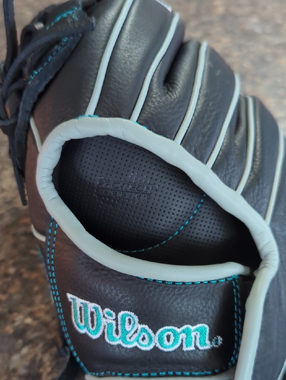 Wilson Black and Light Gray Men's Baseball Glove with Teal Stitching